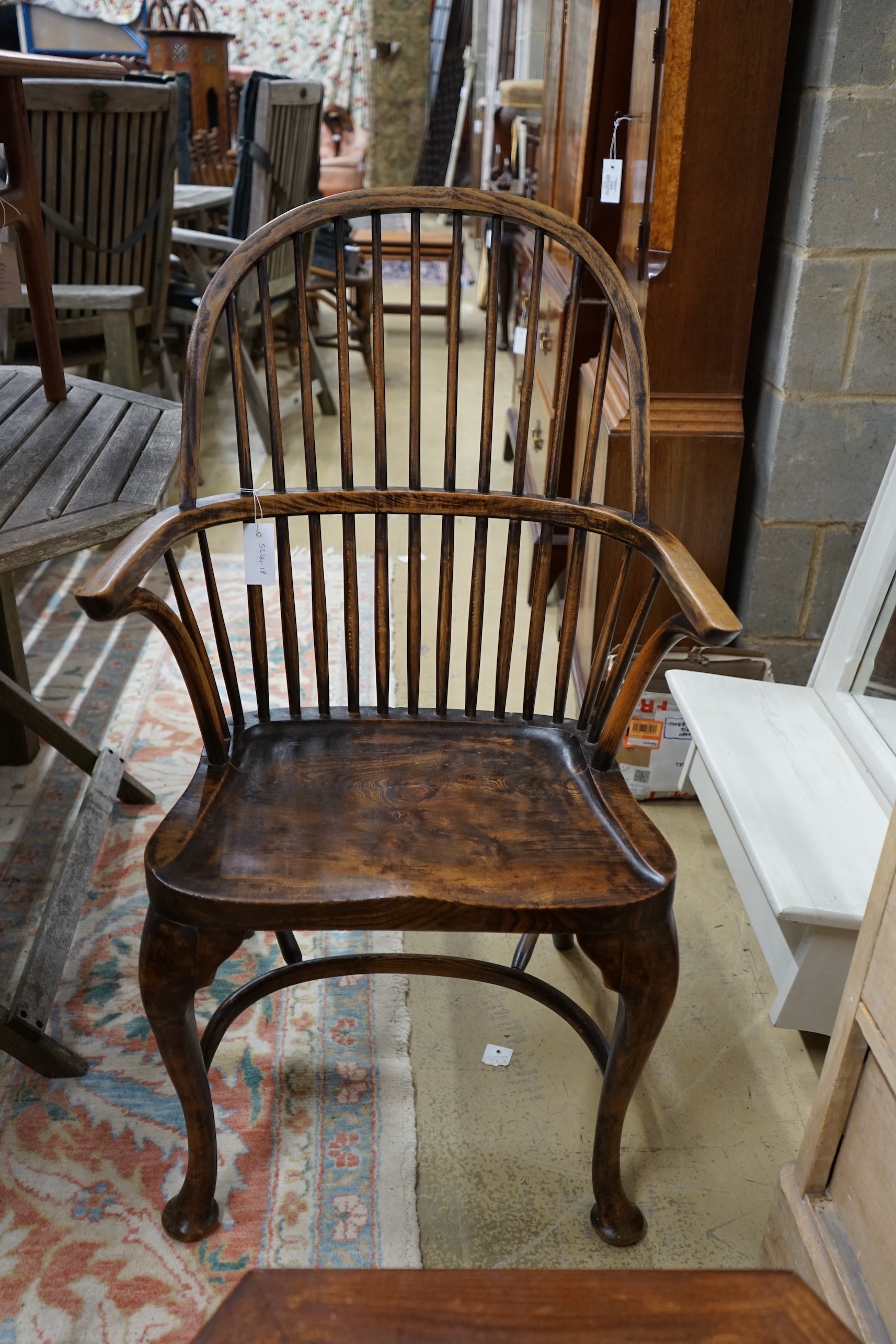 A Windsor elm and beech comb back elbow chair, width 59cm, depth 39cm, height 102cm